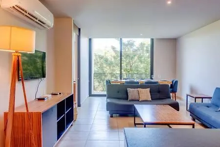 Captivating Rooftop Pool, Gym, Wifi L Free Parking Playa del Carmen Apartment